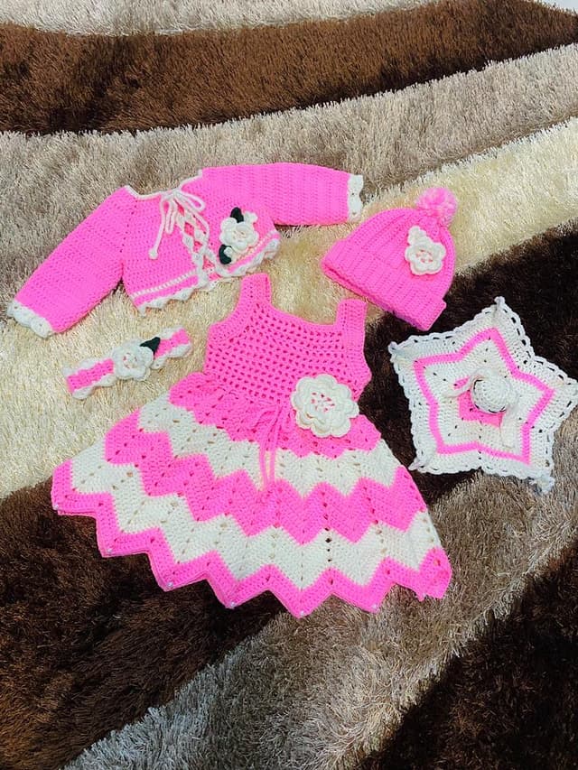 Red crochet dress with petal detail and fringe